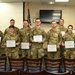Pennsylvania Air National Guard and Pennsylvania National Guard members pose after completing CPR and automated external defibrillator (AED) certification during a TAG Safety Stand Down