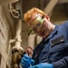 USS Iwo Jima Sailor Conducts Maintenance