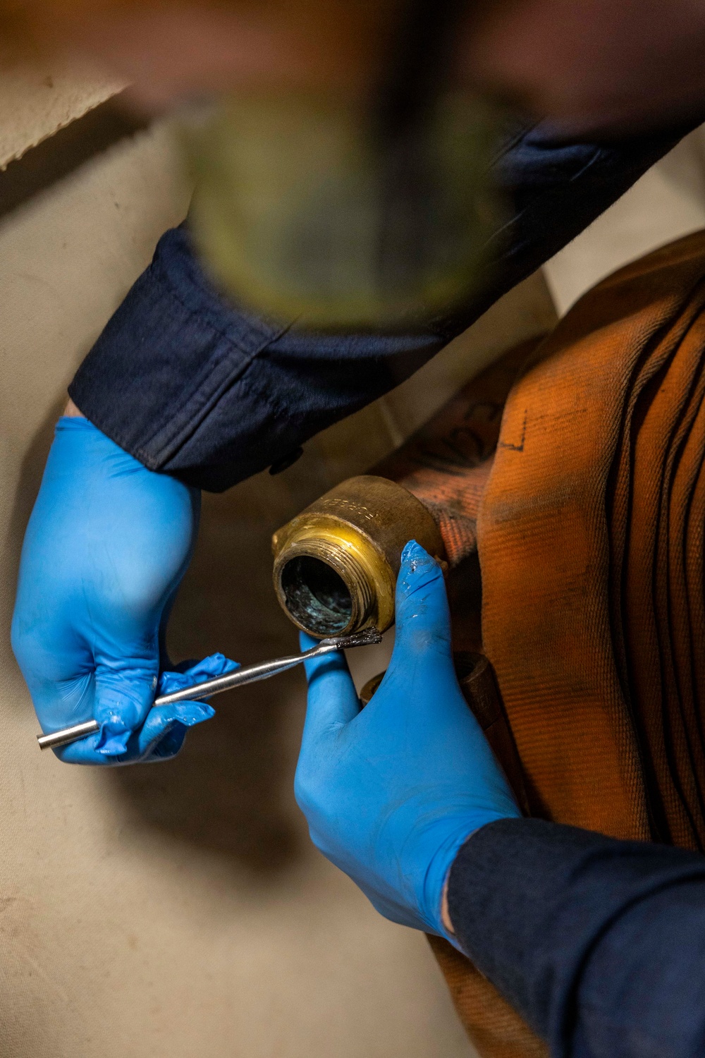 USS Iwo Jima Sailor Conducts Maintenance