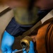 USS Iwo Jima Sailor Conducts Maintenance