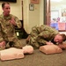 U.S. Air Force Staff Sgt. Despirito participates with a fellow airman as he demonstrates rescue techniques on a CPR training mannequin