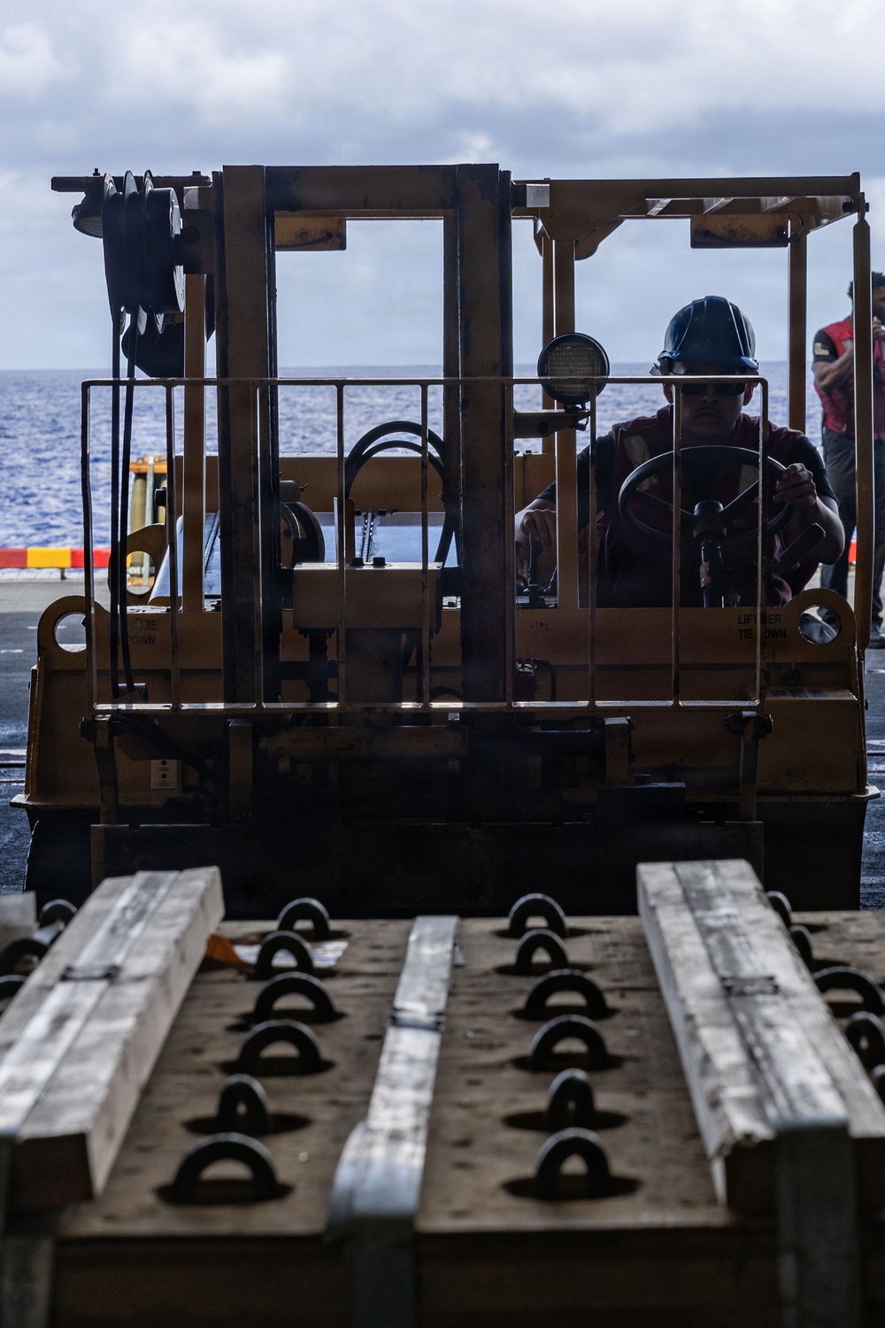USS Iwo Jima Sailors Move Ordnance
