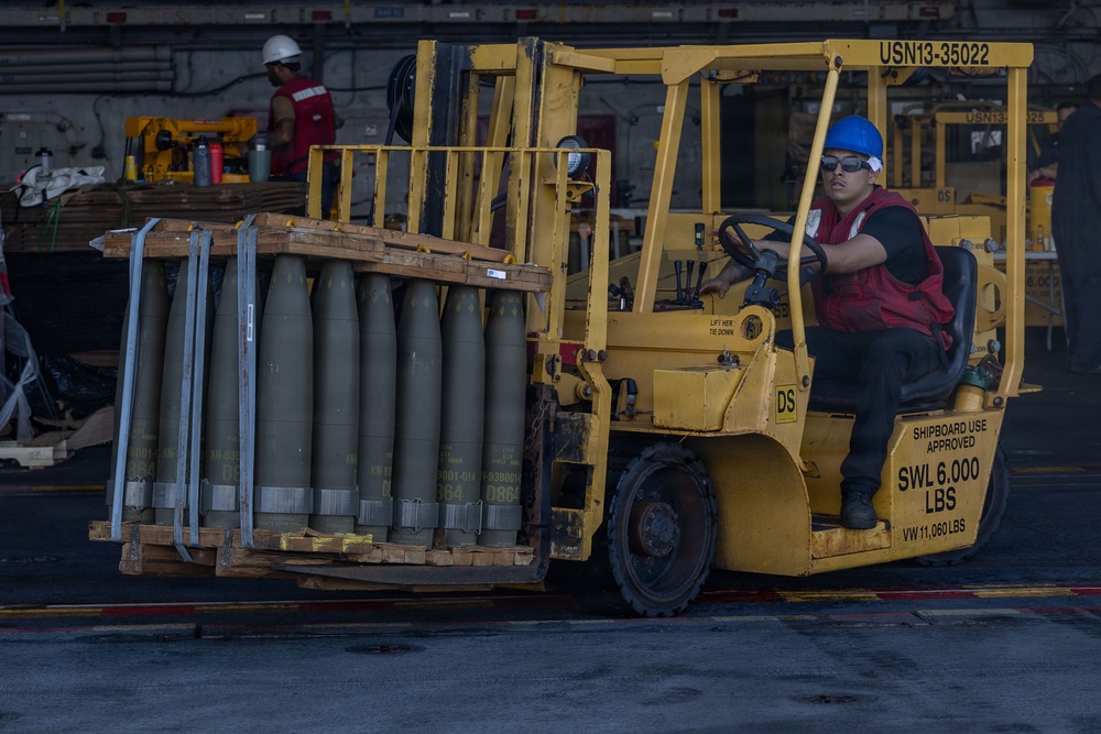 USS Iwo Jima Sailors Move Ordnance