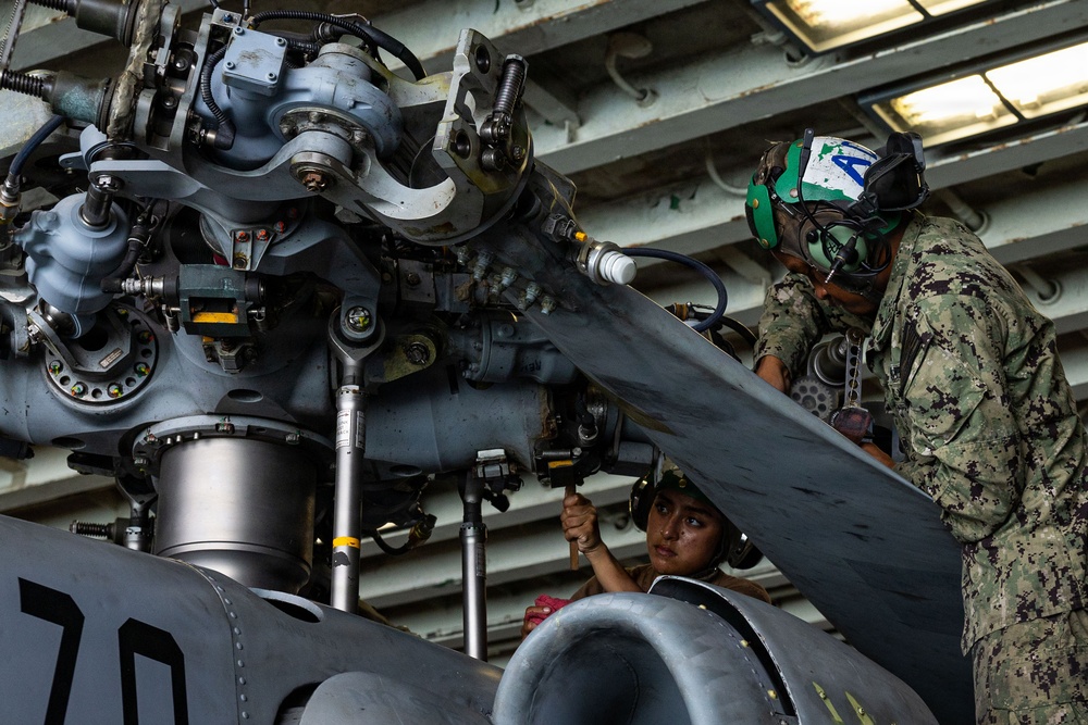 MH-60S Sea Hawks maintenance aboard USS Iwo Jima