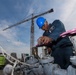 Bataan Sailors Sand a Fuel Station for Repainting