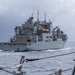 USS Mustin conducts a replenishment-at-sea with USNS Wally Schirra