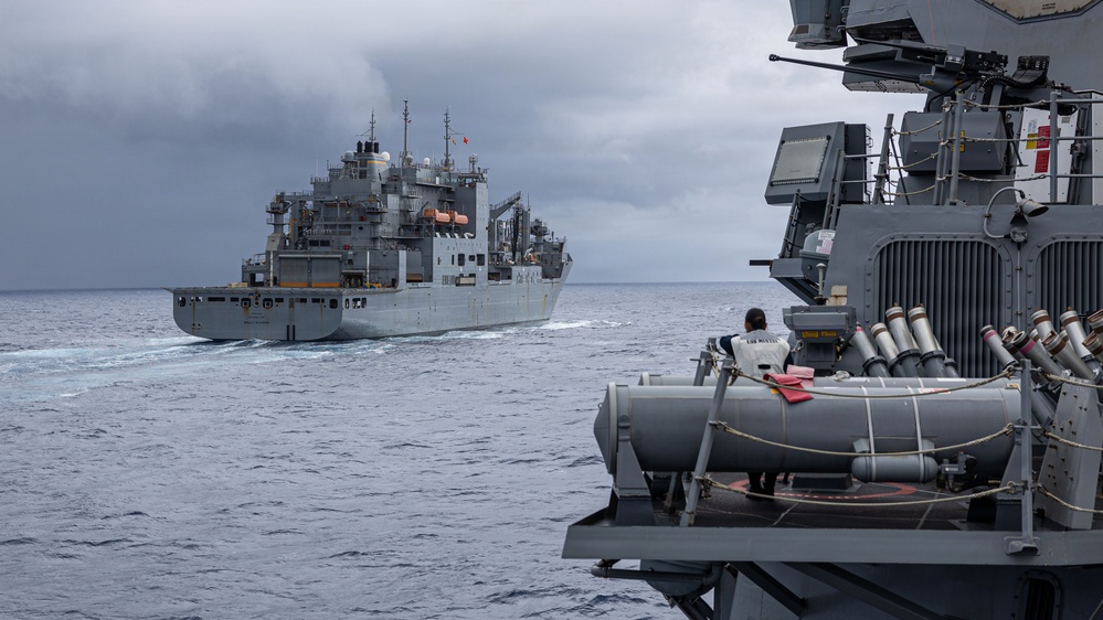USS Mustin conducts a replenishment-at-sea with USNS Wally Schirra