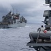 USS Mustin conducts a replenishment-at-sea with USNS Wally Schirra