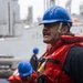 USS Mustin conducts a replenishment-at-sea with USNS Wally Schirra