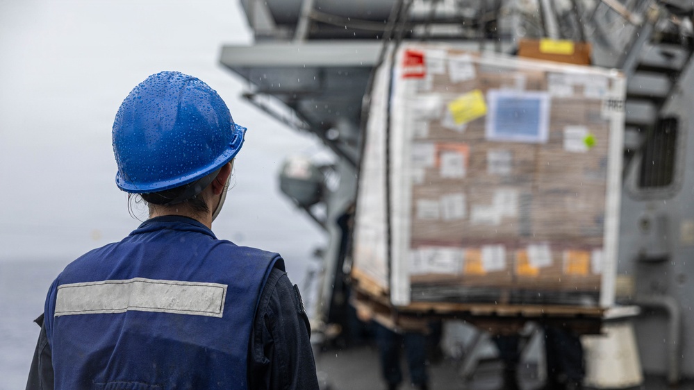 USS Mustin conducts a replenishment-at-sea with USNS Wally Schirra