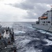 USS Mustin conducts a replenishment-at-sea with USNS Wally Schirra