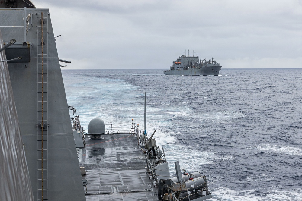 USS Mustin conducts a replenishment-at-sea with USNS Wally Schirra