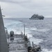 USS Mustin conducts a replenishment-at-sea with USNS Wally Schirra