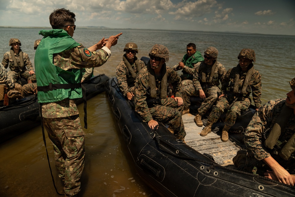 U.S. Marines and Romanian forces conduct combat rubber raiding craft operations in Romania