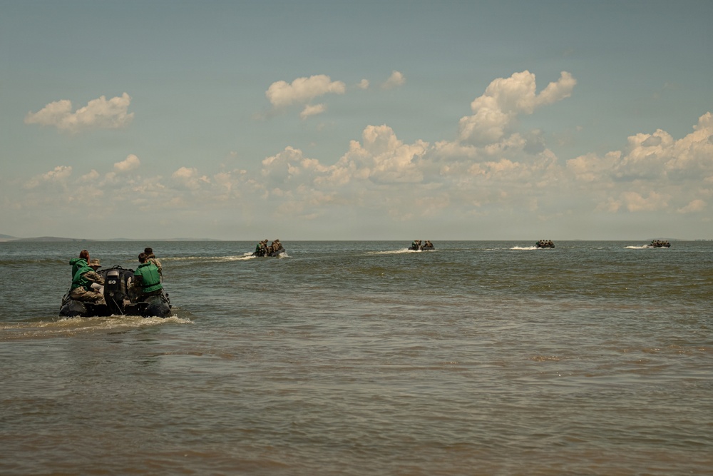 U.S. Marines and Romanian forces conduct combat rubber raiding craft operations in Romania