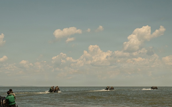 U.S. Marines and Romanian forces conduct combat rubber raiding craft operations in Romania