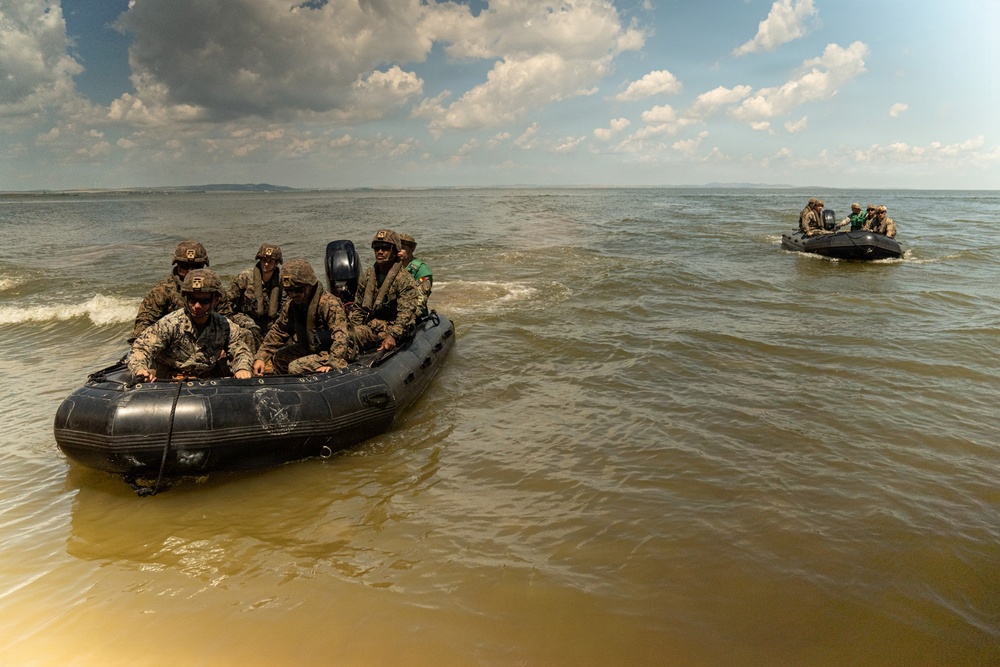 U.S. Marines and Romanian forces conduct combat rubber raiding craft operations in Romania