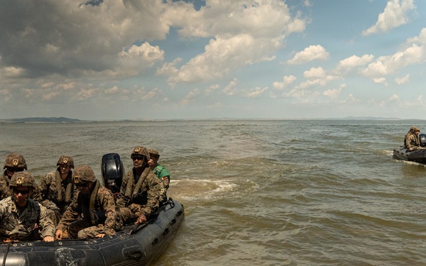 U.S. Marines and Romanian forces conduct combat rubber raiding craft operations in Romania