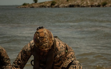 U.S. Marines and Romanian forces conduct combat rubber raiding craft operations in Romania