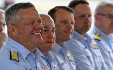 U.S. Coast Guard Officers Attend Outdoor Military Ceremony