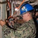 NNS Helps Sailors Use Pneumatic Drill