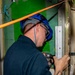 NNS Helps Sailors Use Pneumatic Drill