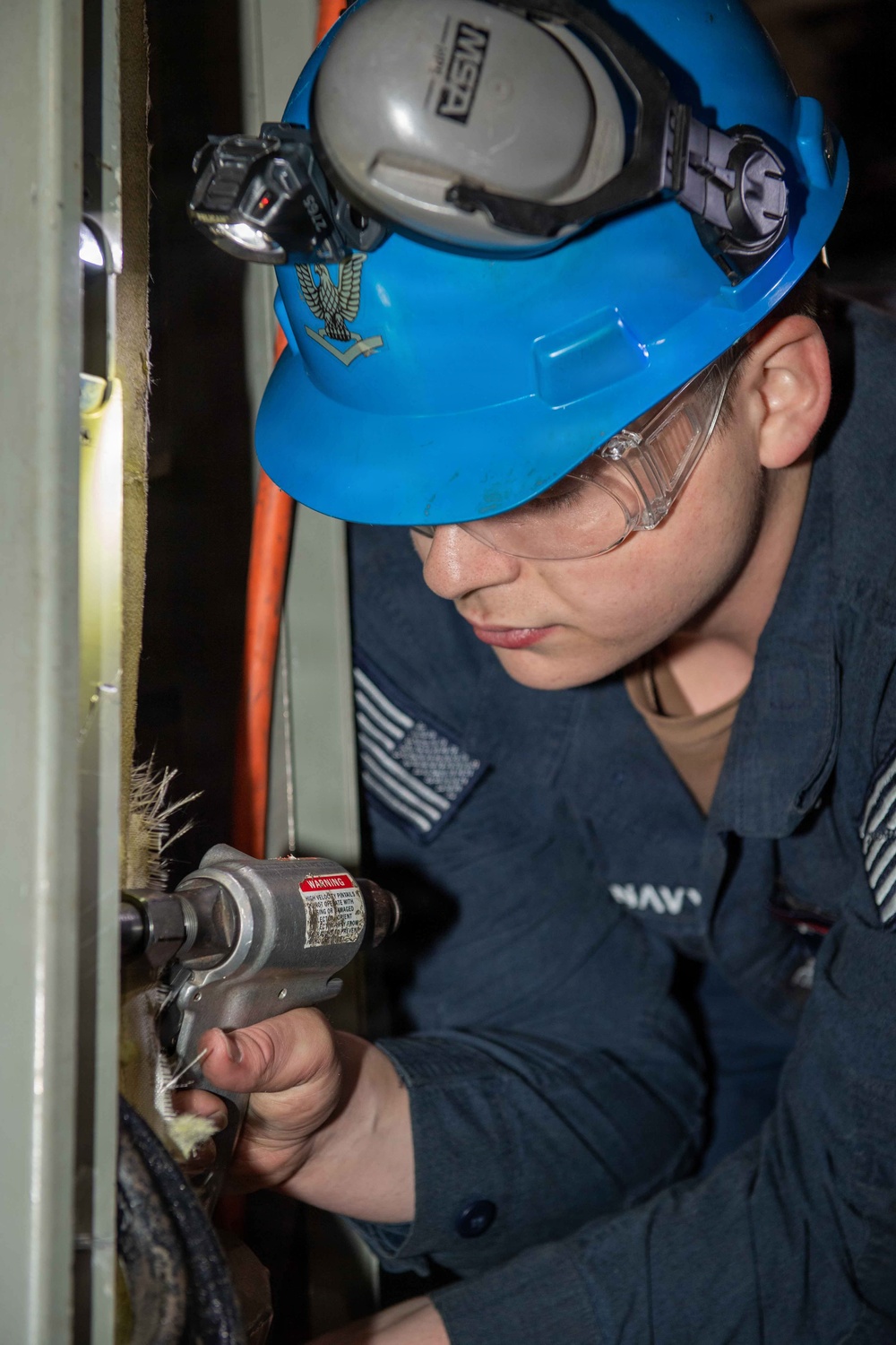 NNS Helps Sailors Use Pneumatic Drill