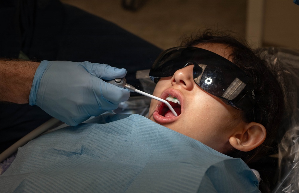 Children show their pearly whites for dental day
