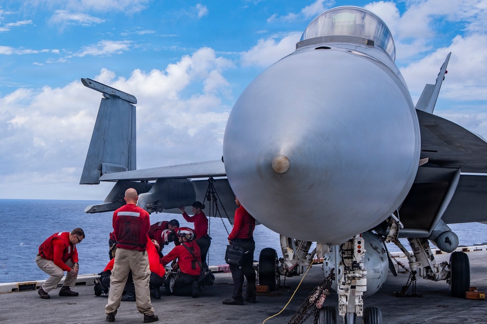 Nimitz Sailors Load Ordnance