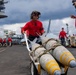 Nimitz Sailors Load Ordnance