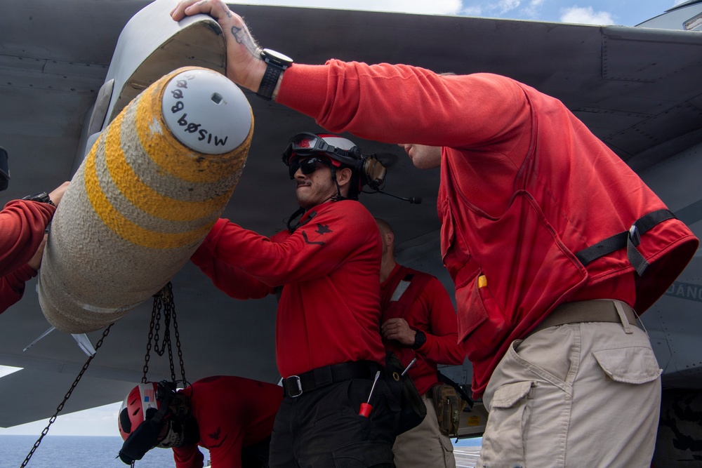 Nimitz Sailors Load Ordnance