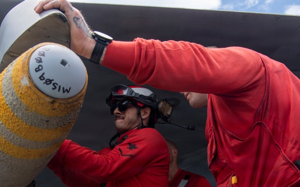 Nimitz Sailors Load Ordnance