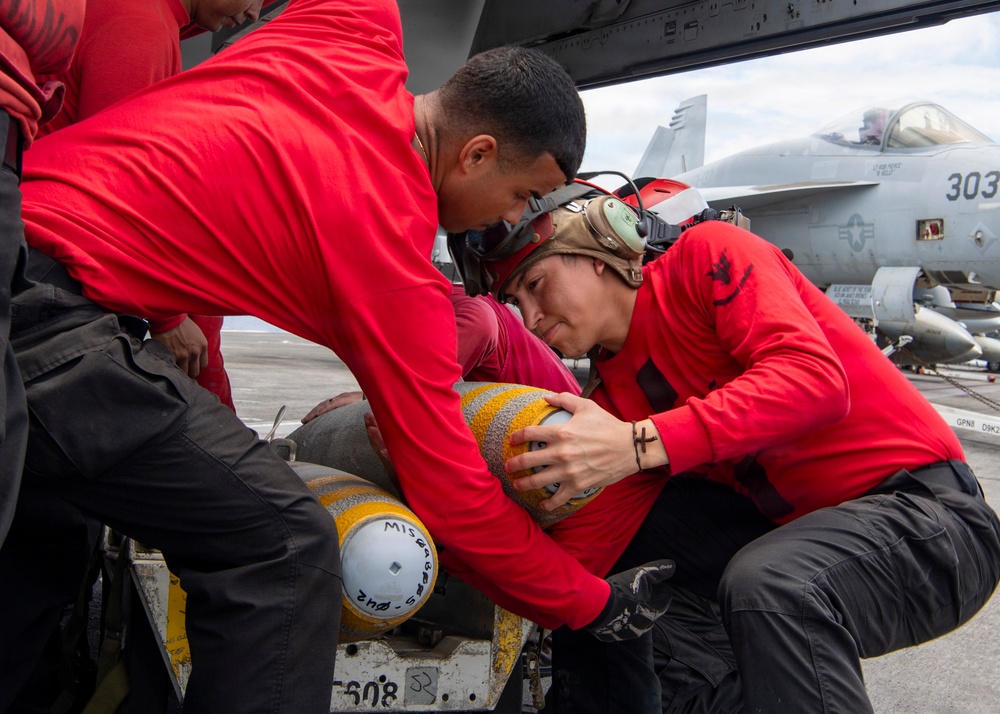Nimitz Sailors Load Ordnance