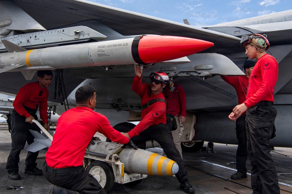 Nimitz Sailors Load Ordnance