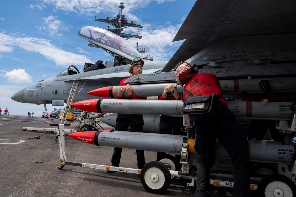 Nimitz Sailors Load Ordnance
