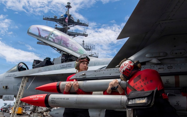 Nimitz Sailors Load Ordnance