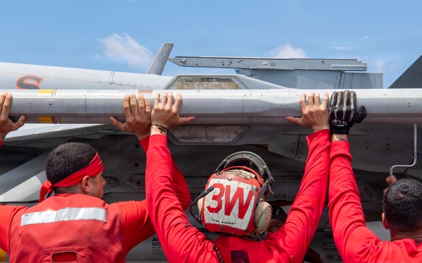 Nimitz Sailors Load Ordnance