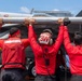 Nimitz Sailors Load Ordnance