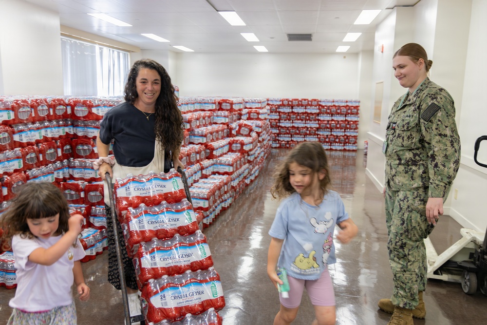 CFAY Distributes Water to Community Members, Tenants