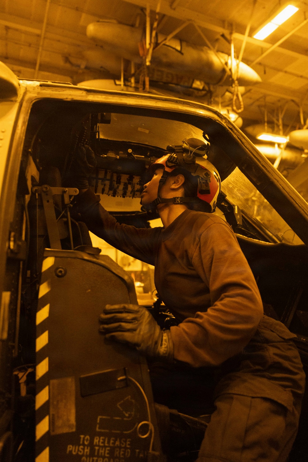 USS George H.W. Bush maintains the cockpit of an MH-60S Sea Hawk