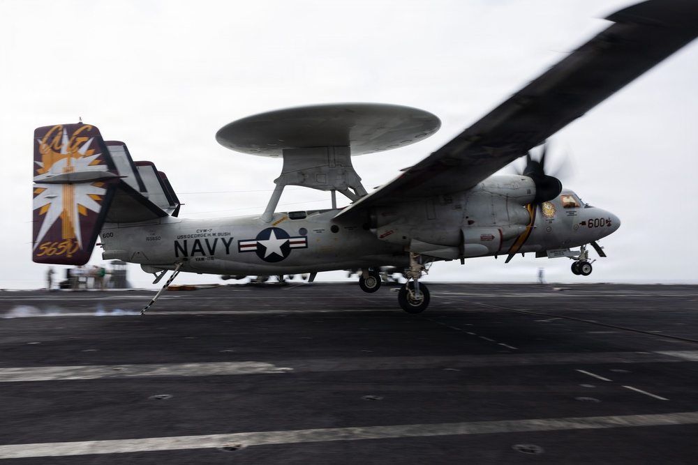 USS George H.W. Bush lands a E-2C Hawkeye