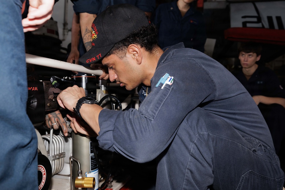 USS George H.W. Bush maintains an air compressor