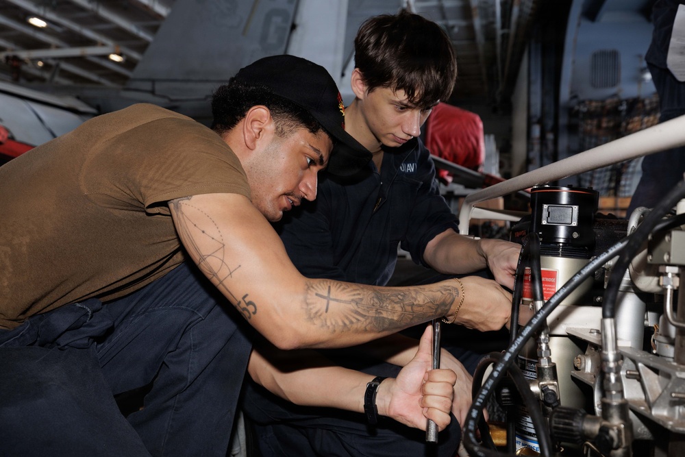USS George H.W. Bush maintains an air compressor