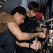 USS George H.W. Bush maintains an air compressor