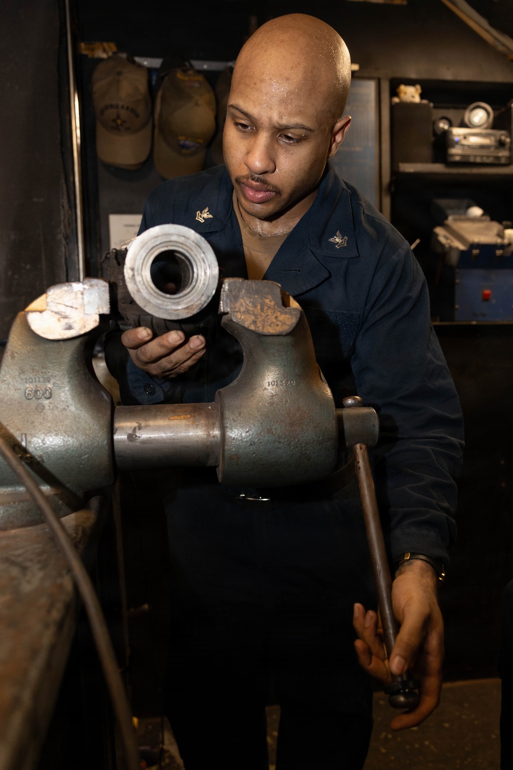 USS George H.W. Bush maintains catapult equipment