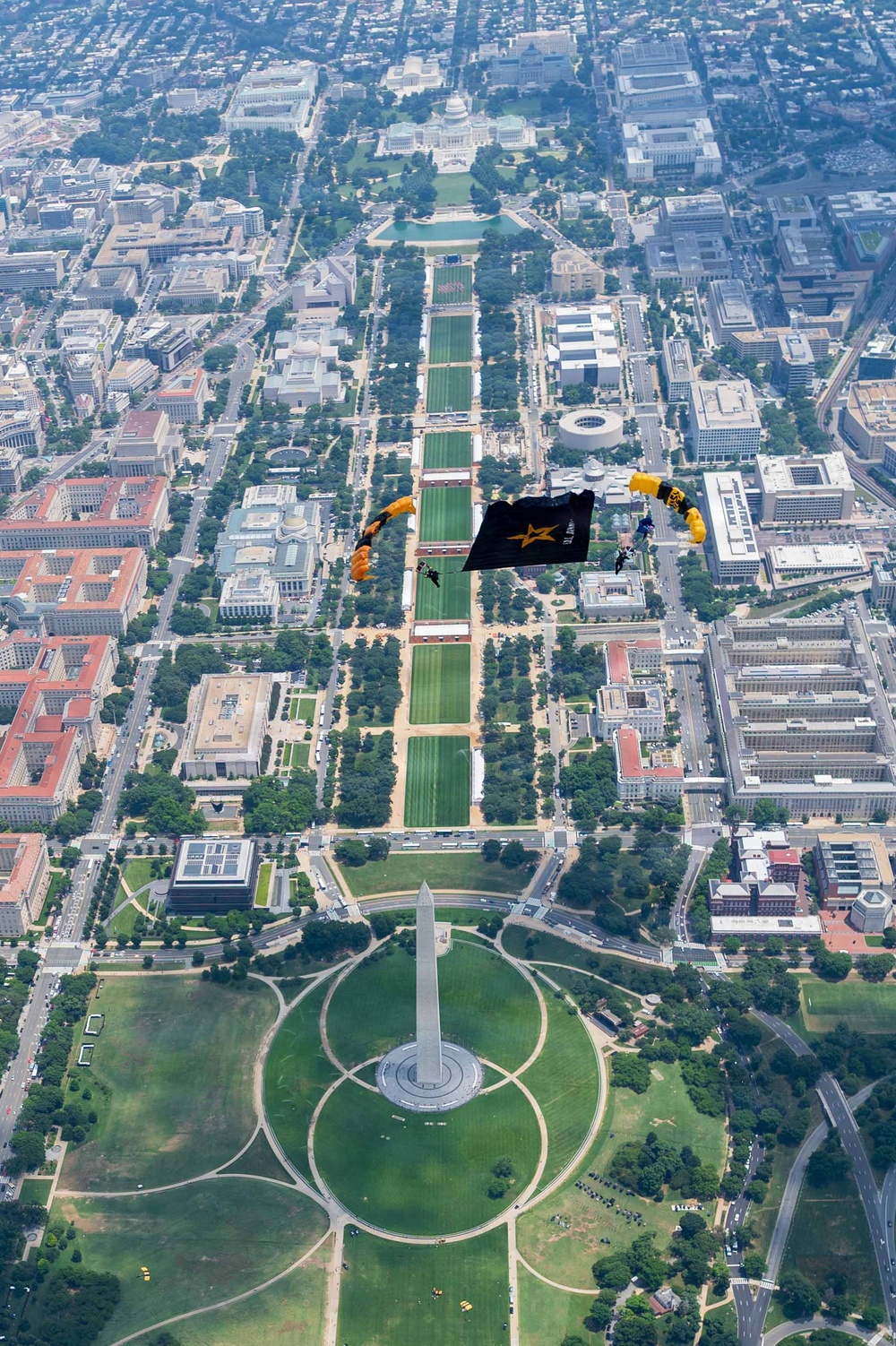 The U.S. Army Parachute Team jumps over Washington Monument for Freedom 250 events