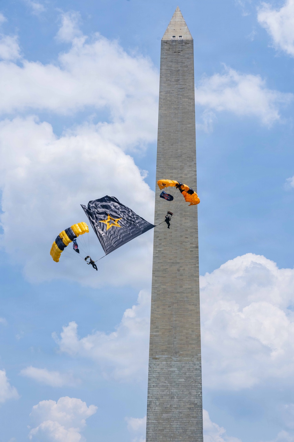 The U.S. Army Parachute Team jumps over Washington Monument for Freedom 250 events