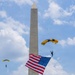 The U.S. Army Parachute Team jumps over Washington Monument for Freedom 250 events