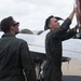 French Navy Aviator and a Student Naval Aviator Exit T-44C Pegasus After A Routine Training Flight