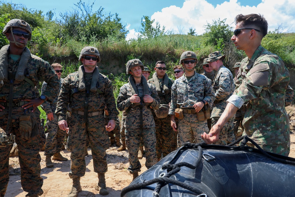U.S. Marines and Romanian forces conduct combat rubber raiding craft operations in Romania